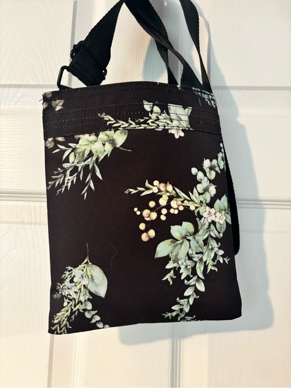 Dakine Black Floral Crossbody with Pale Green Accents - Picture 2 of 3